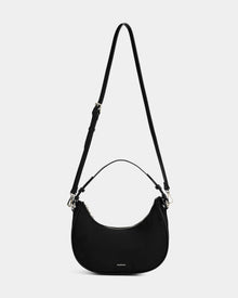 The Rudsak NIKKI - L325512 Black is a women's crescent shoulder bag with a hobo silhouette, short handle, adjustable crossbody strap, silver hardware, and small logo near the bottom, shown on a plain white background.