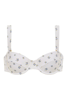 White bustier bikini top with small blue and yellow floral print throughout and adjustable shoulder straps.