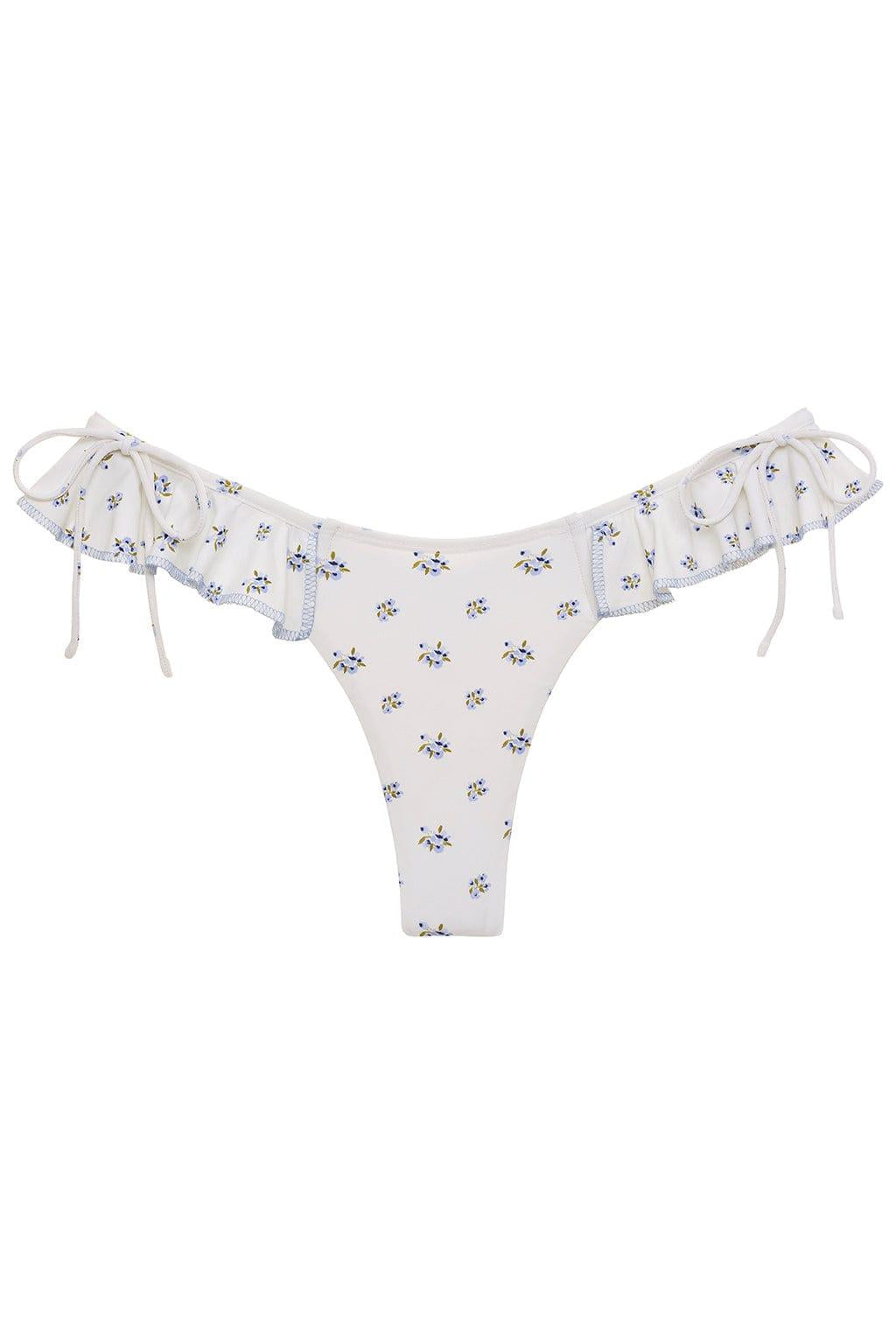 Cream bikini bottom with small blue and yellow floral print, ruffled trim on sides with bows and adjustable tie straps.