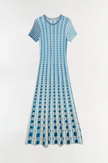 Blue and white knit midi dress with eyelet pattern and short sleeves on neutral background.