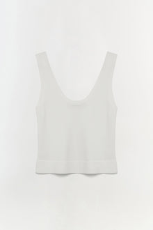 White sleeveless tank top with a scoop neckline and ribbed trim at the hem.