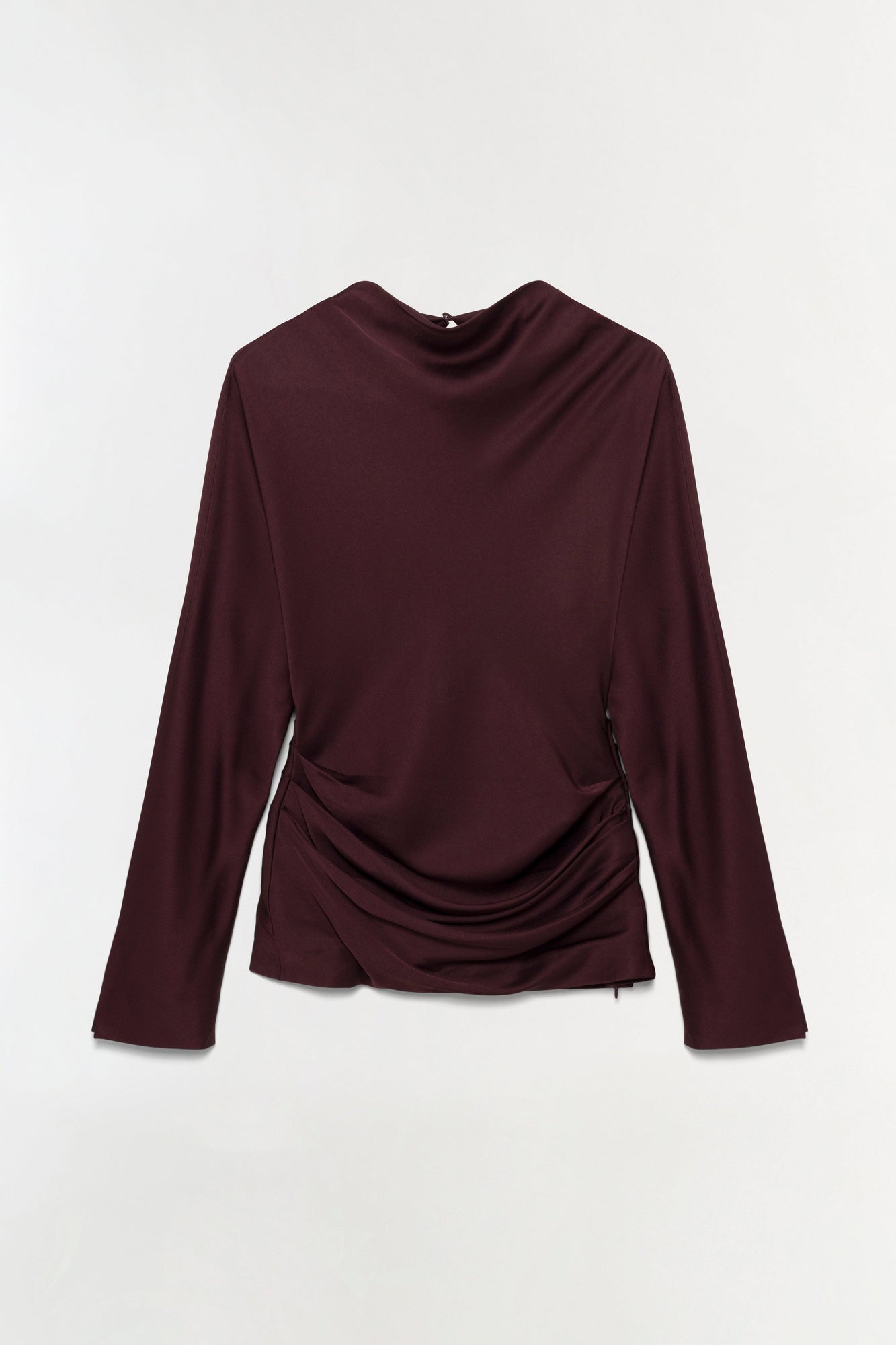 Burgundy satin long-sleeve top with draped neckline and ruched side detail.