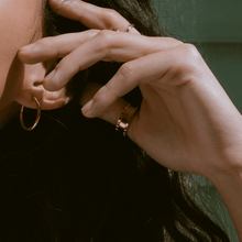 Lifestyle Model. Close up of woman's hand wearing various rings