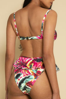 Floral bikini bottom in pink, red, yellow, and green with ruffled waistband detail.