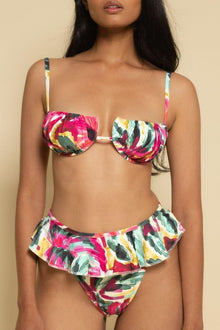 Floral bikini bottom in pink, yellow, and green with ruffle detailing at leg openings.