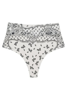 High-rise bikini bottom with black and white bandana print featuring paisleys, florals, and geometric patterns throughout.