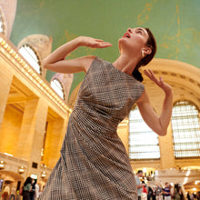 Front image of a woman wearing the jeannine dress in plaid sharkskin