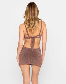 Model wearing the Karter Bralette Top paired with the Casey Mini Skirt in brown shimmer fabric, featuring double waistband detail, from the latest resortwear collectio