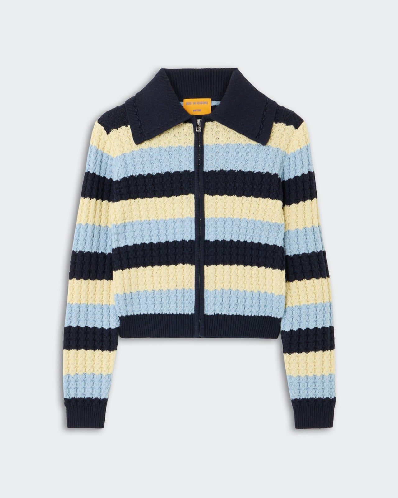 Kirby Jacket - Midnight Combo, a zip-up knit jacket with textured cable knit stripes in navy, pale yellow, and soft blue, featuring a classic collar and ribbed cuffs and hem.