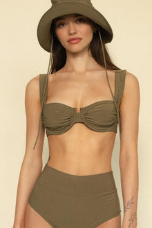 Khaki bikini top with underwire cups, ruched detail, and adjustable tie straps on a model wearing matching high-waisted botto