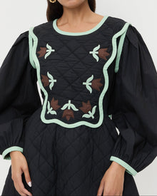 Laney Short Dress in quilted black cotton with mint and brown floral design.
