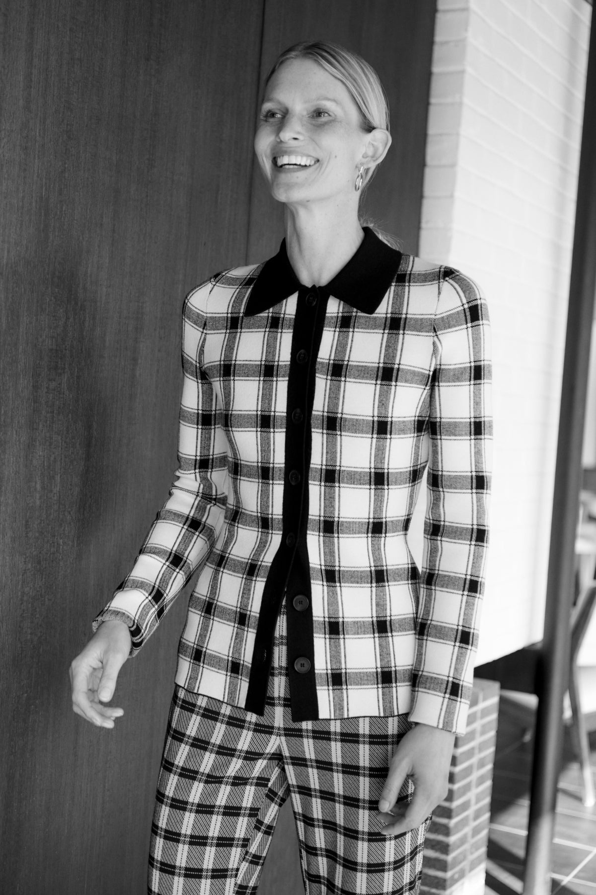 Front image of a woman wearing the horton pants in checkmate | Exclude