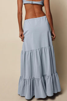 Light blue denim skirt with tiered ruffled hem and high waist design.