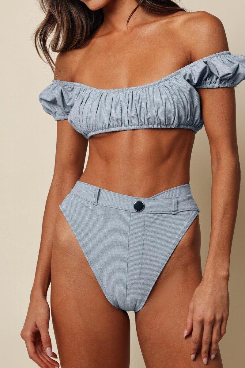 Light blue denim bikini bottom with high-waisted cut and black button detail at waistband.
