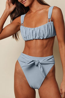 Light blue textured bikini bottom with side tie-up closure and high-cut design.