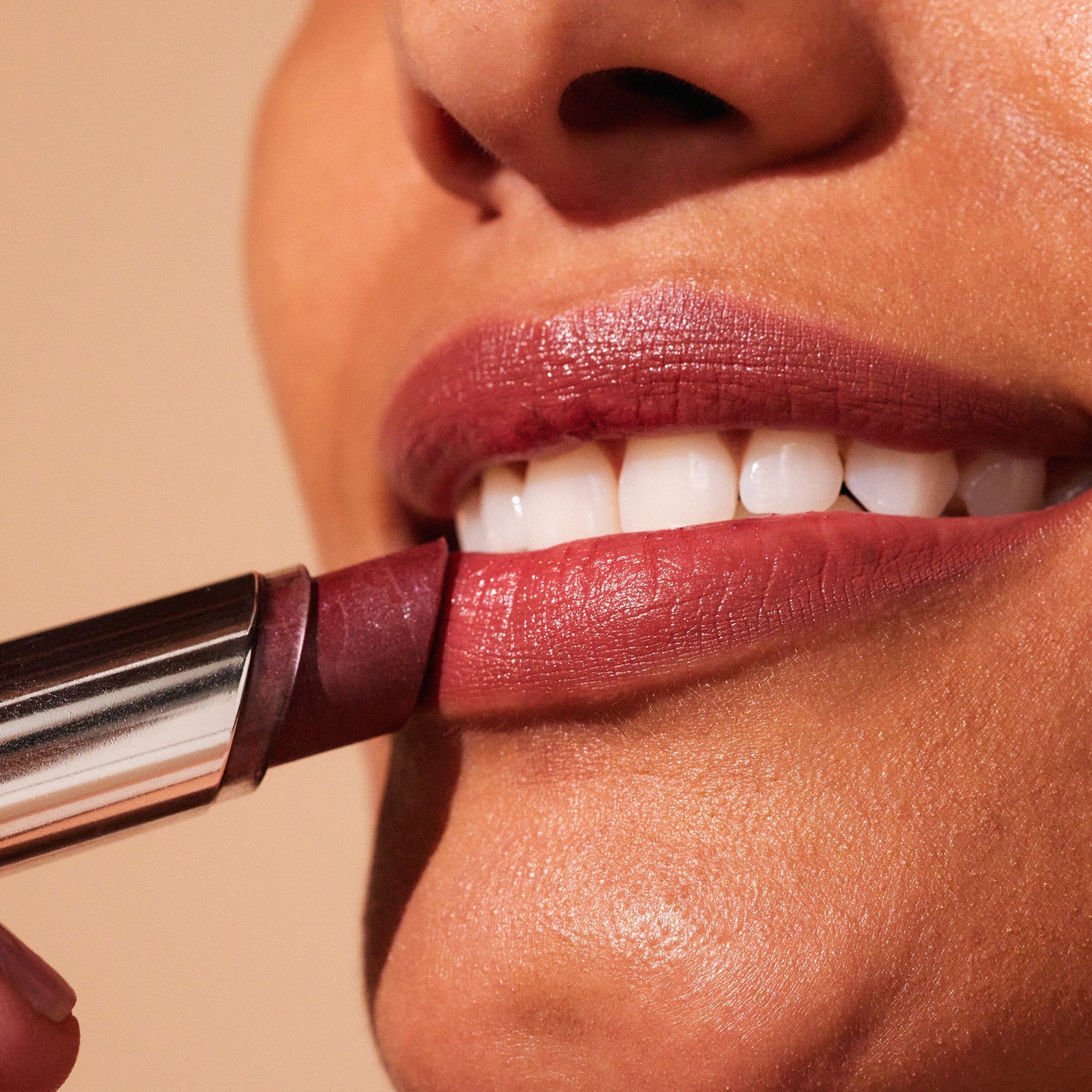 Three lipsticks with silver casings on a white background, featuring the MDSolarSciences brand.