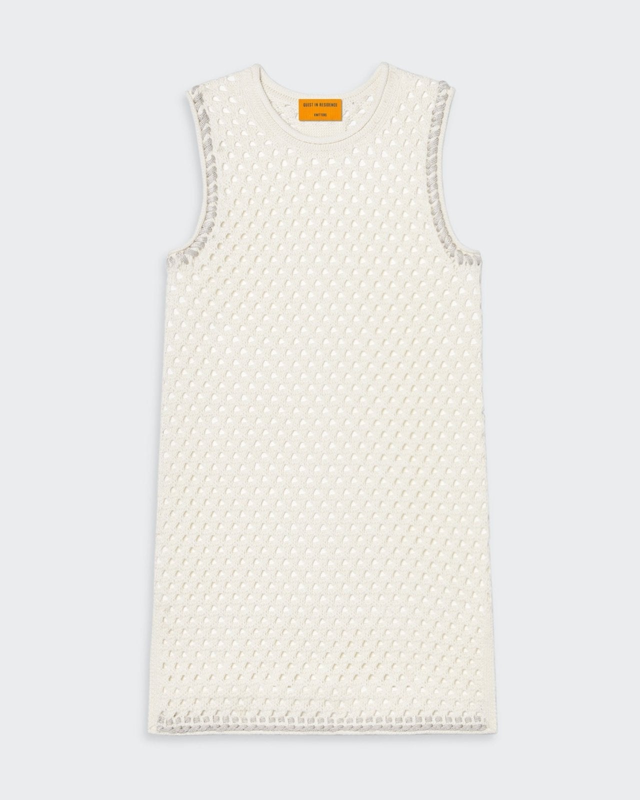 Cream mesh tunic with crochet rope trim and jersey roll at neck and armhole.