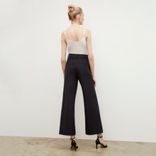 Back image of a woman wearing the Milo Jean in Black