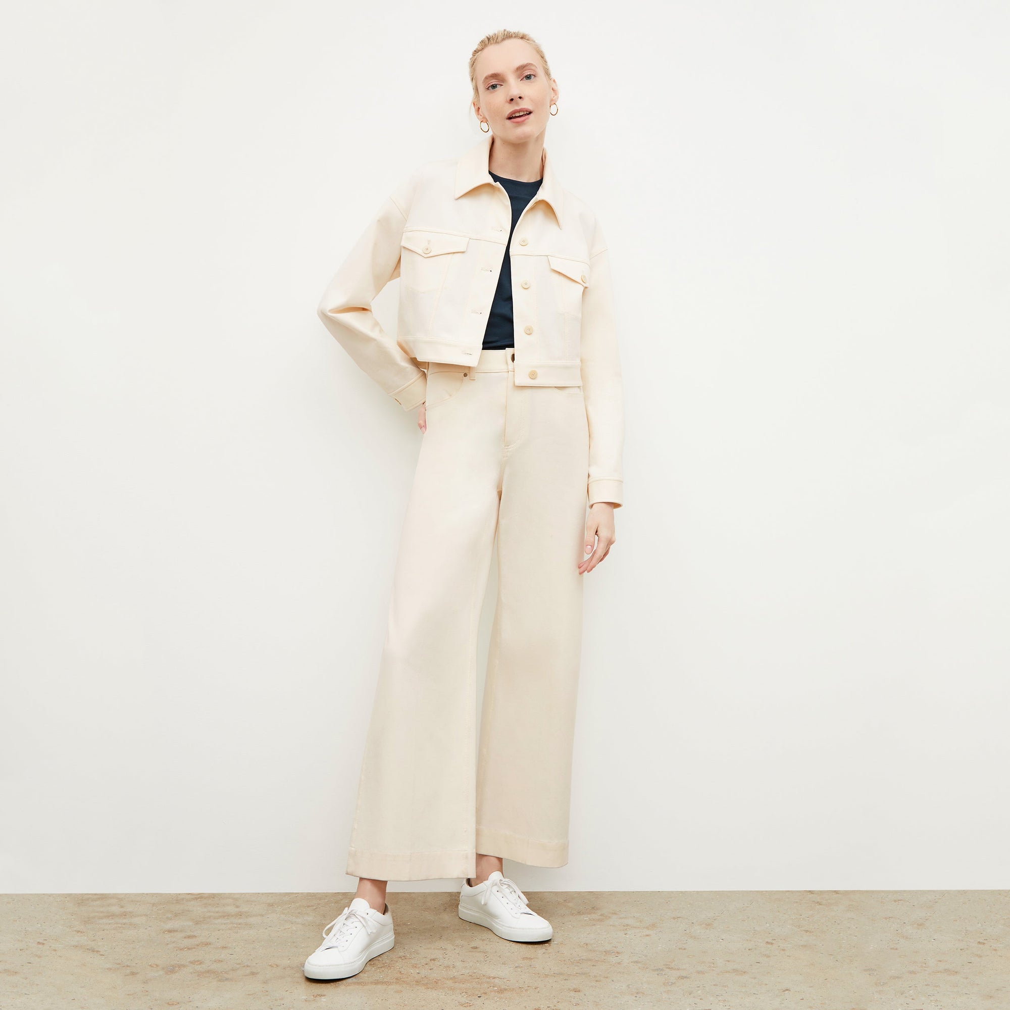 Front image of a woman standing wearing the milo jean in tusk | Exclude