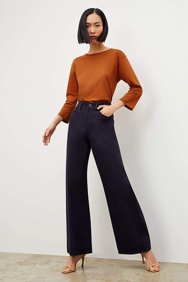 Front image of a woman standing wearing the Milo Jean in ink | Exclude 