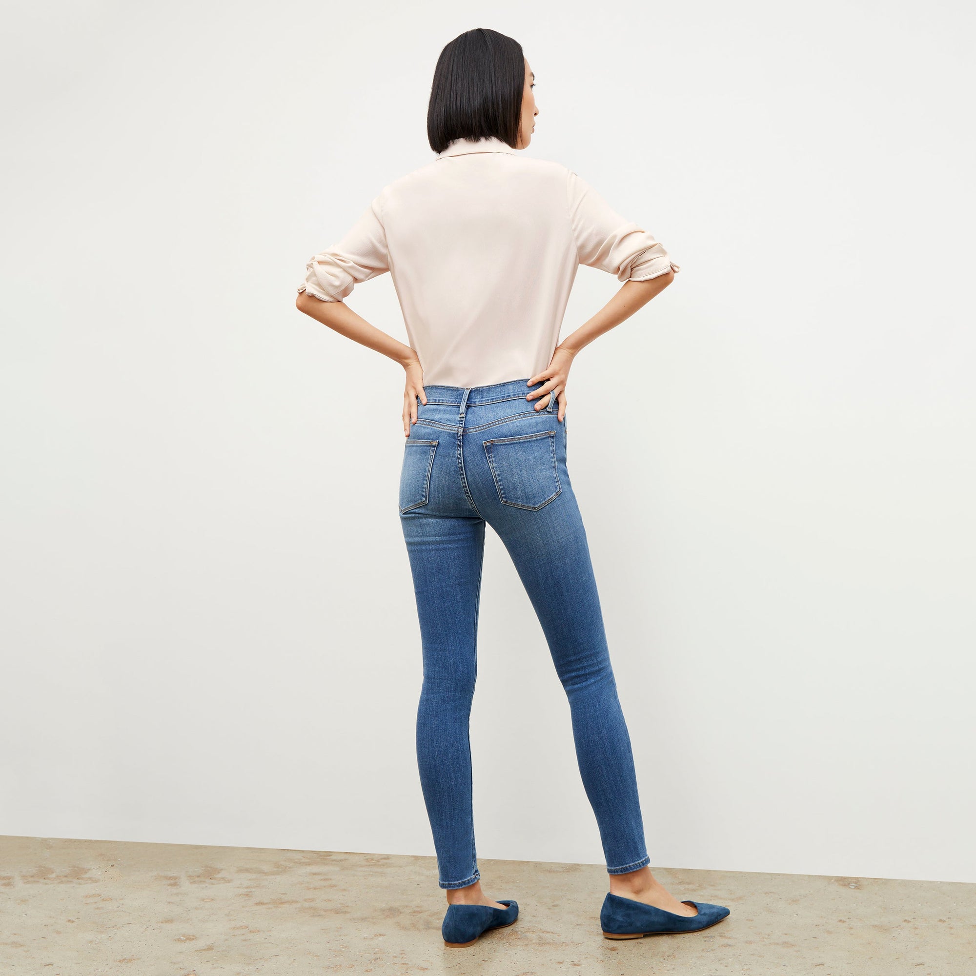 Front image of a woman standing wearing the Lagarde Shirt—Soft Wave in Alabaster | Exclude