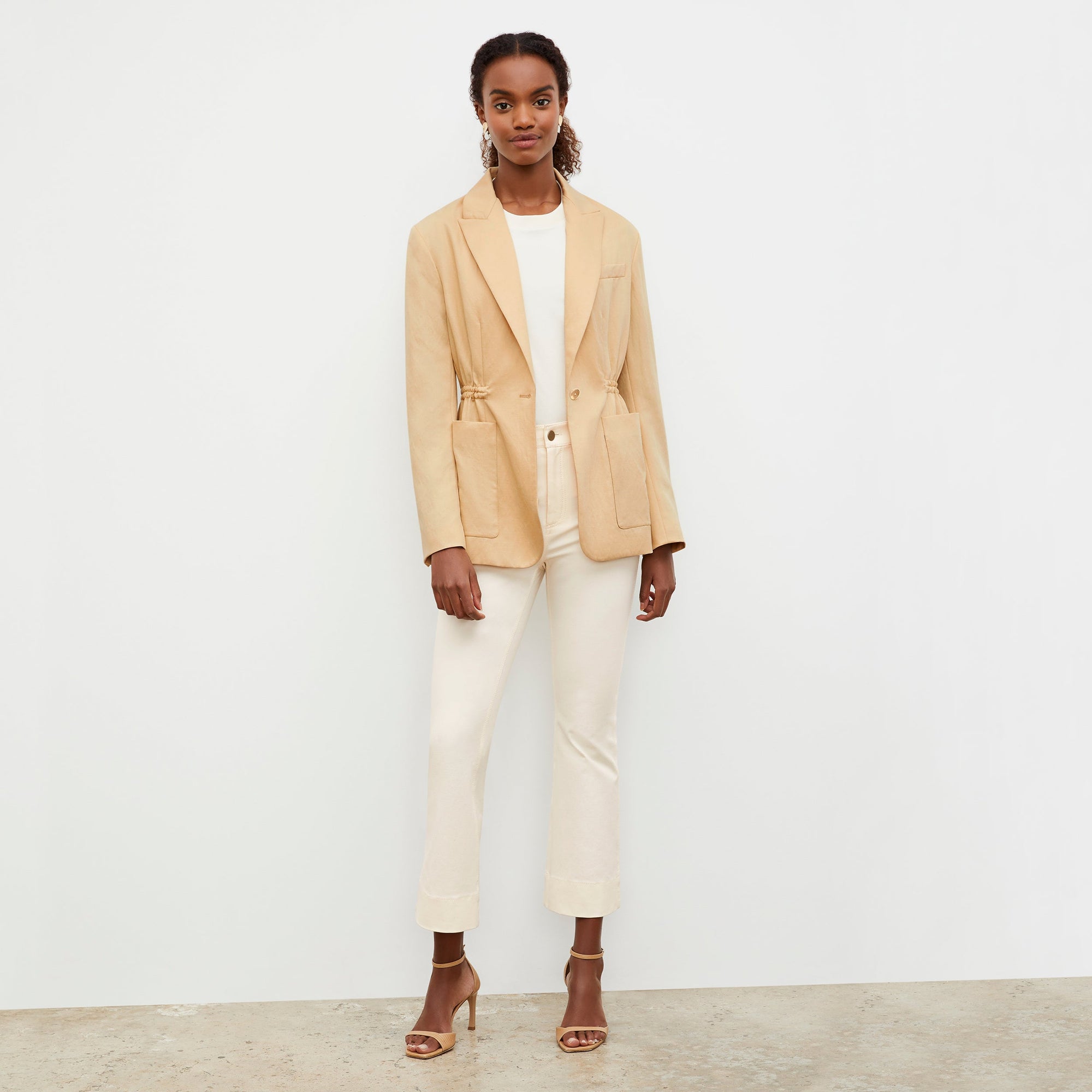 Front image of a woman wearing the Archie Jean in Tusk | Exclude