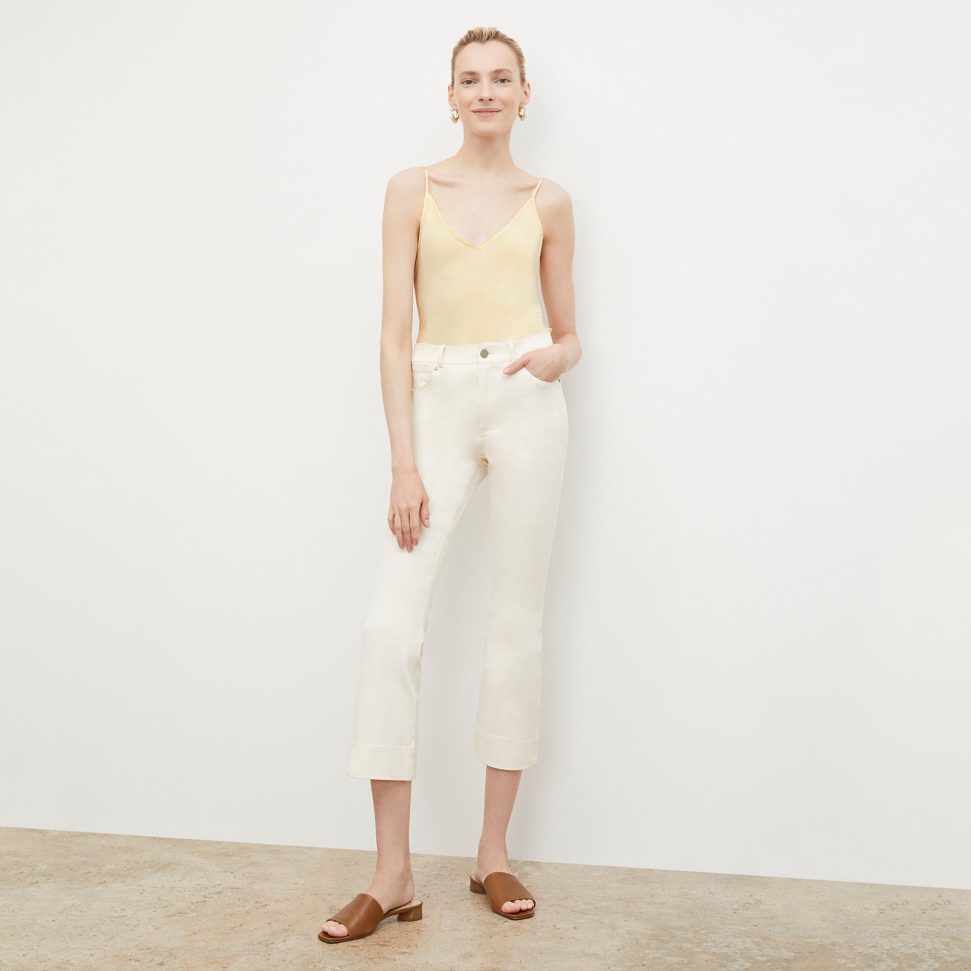 Front image of a woman wearing the Archie Jean in Tusk | Exclude