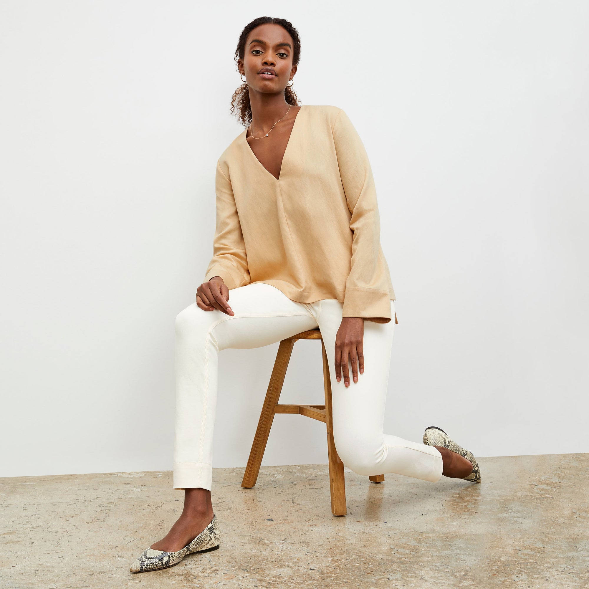 Front image of a woman standing wearing the Hockley Jean—Better Than Denim in Tusk | Exclude