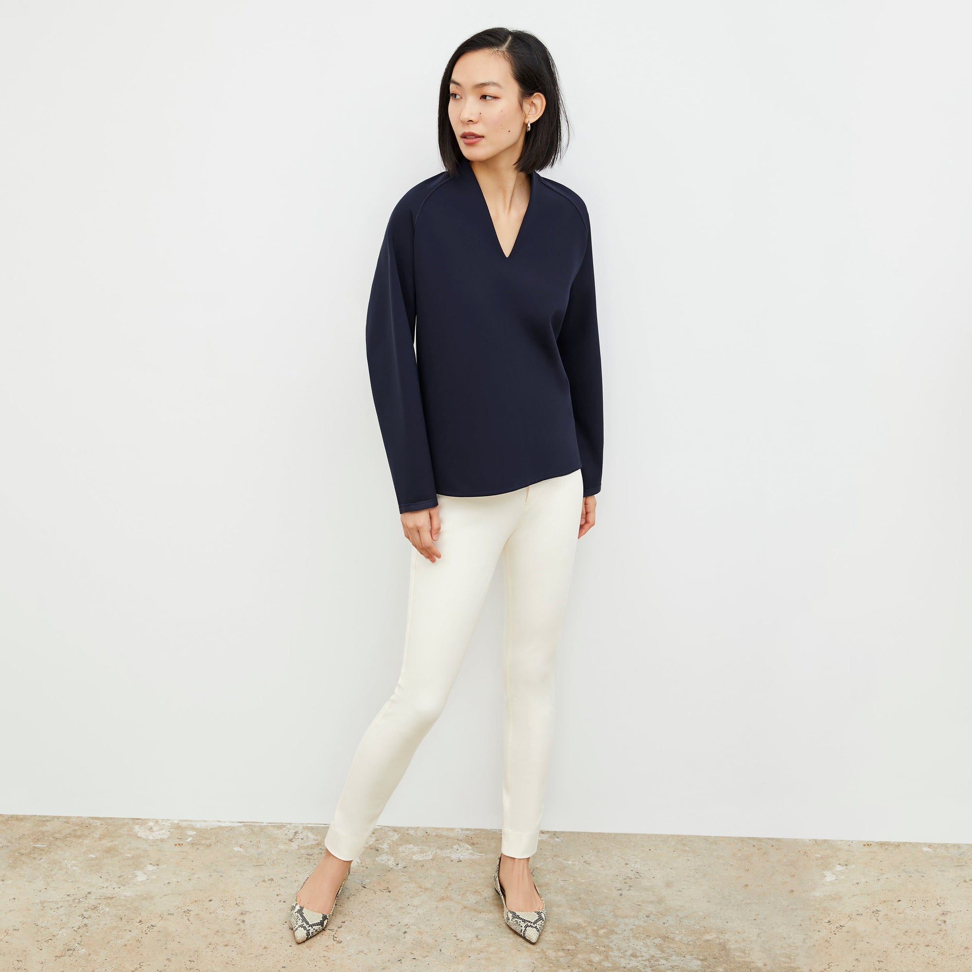Front image of a woman standing wearing the Hockley Jean—Better Than Denim in Tusk | Exclude