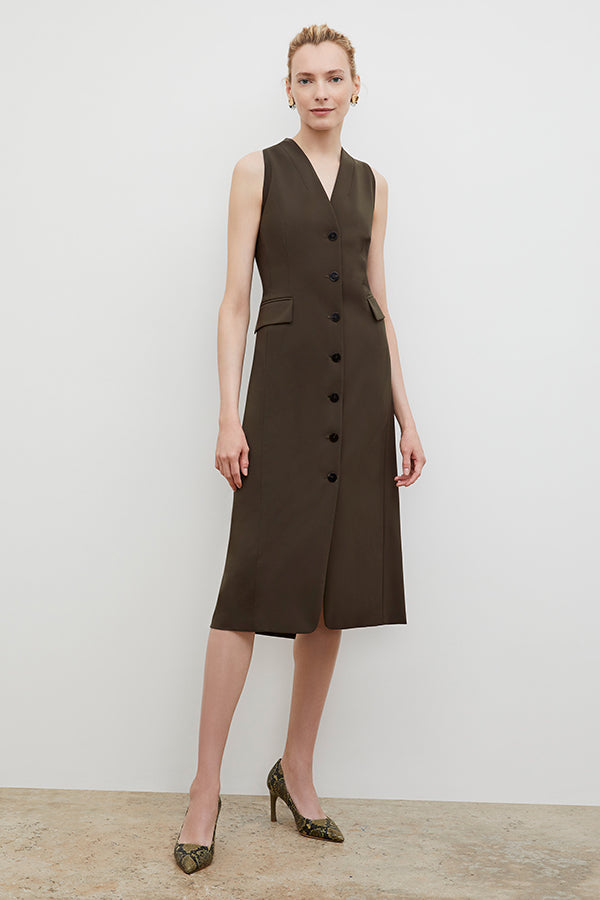 Front image of a woman wearing the Cassandra dress in origamitech in olive | Exclude