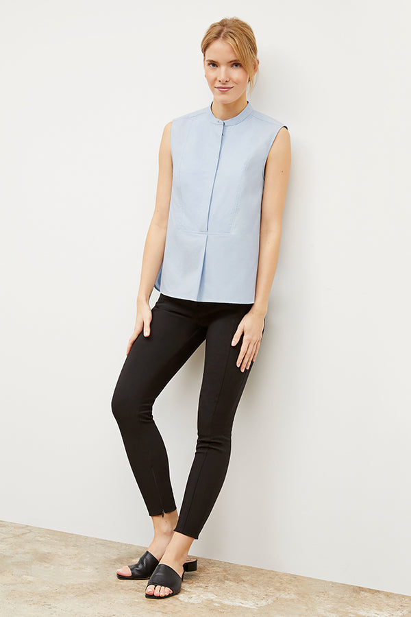 Front image of a woman standing wearing the curie pant in black | Exclude