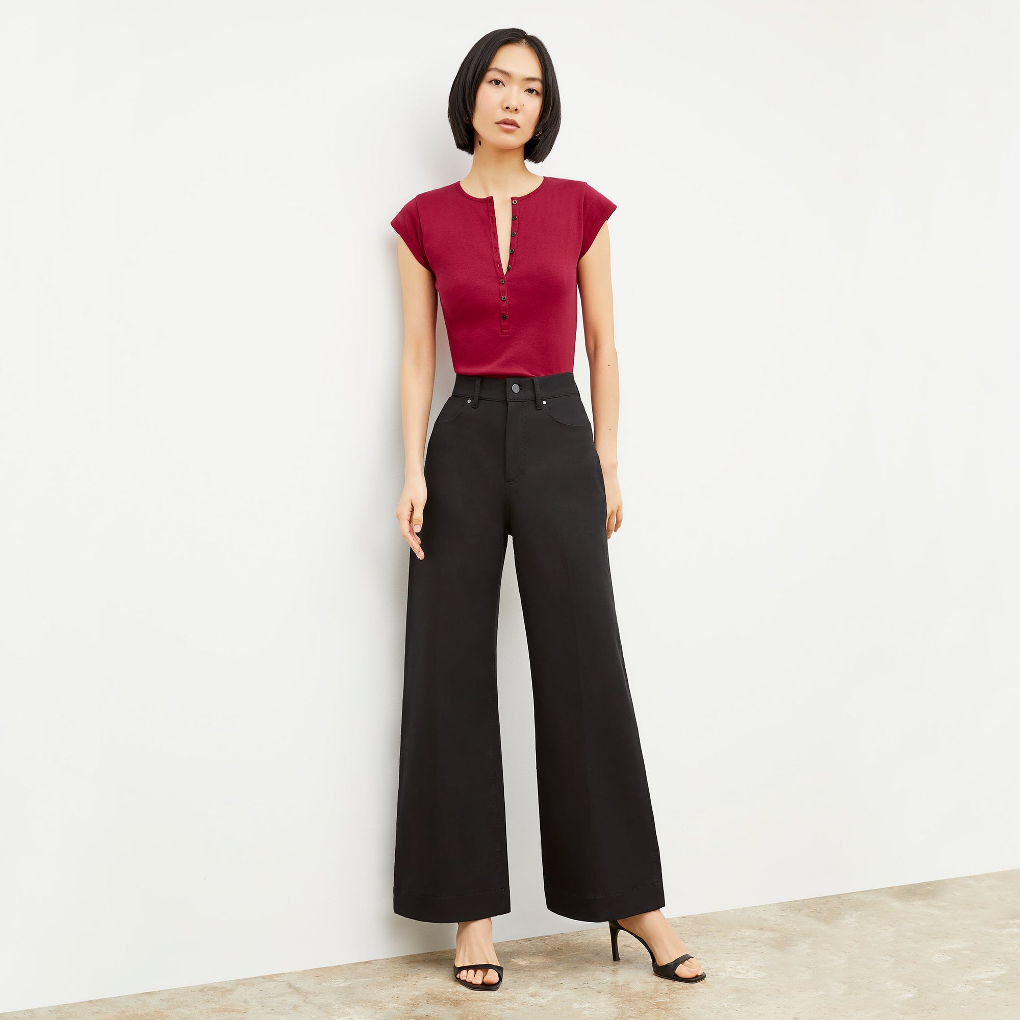 Front image of a woman wearing the Milo Jean in Black | Exclude