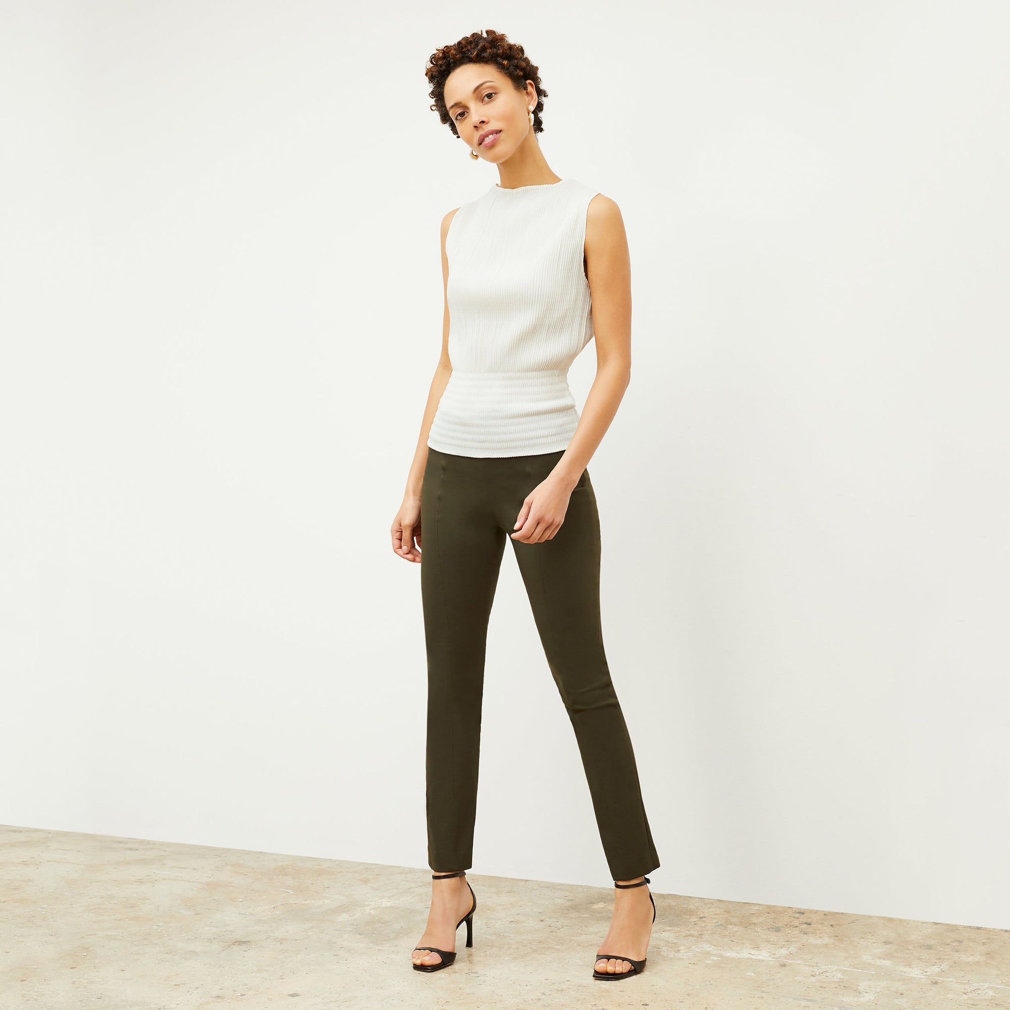 front image of woman wearing foster pant in dark olive | Exclude
