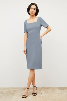 Front image of a woman wearing the Noa Dress - Recycled Wondertex in Steel Blue | Grid | Exclude