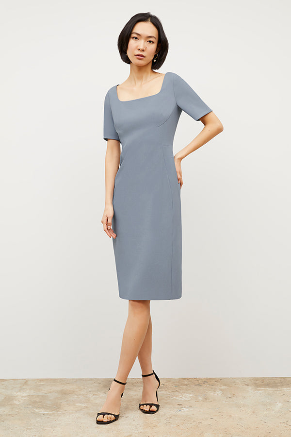 Front image of a woman wearing the Noa Dress - Recycled Wondertex in Steel Blue | Grid | Exclude