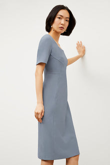 Side image of a woman wearing the Noa Dress - Recycled Wondertex in Steel Blue | Grid Hover | Exclude