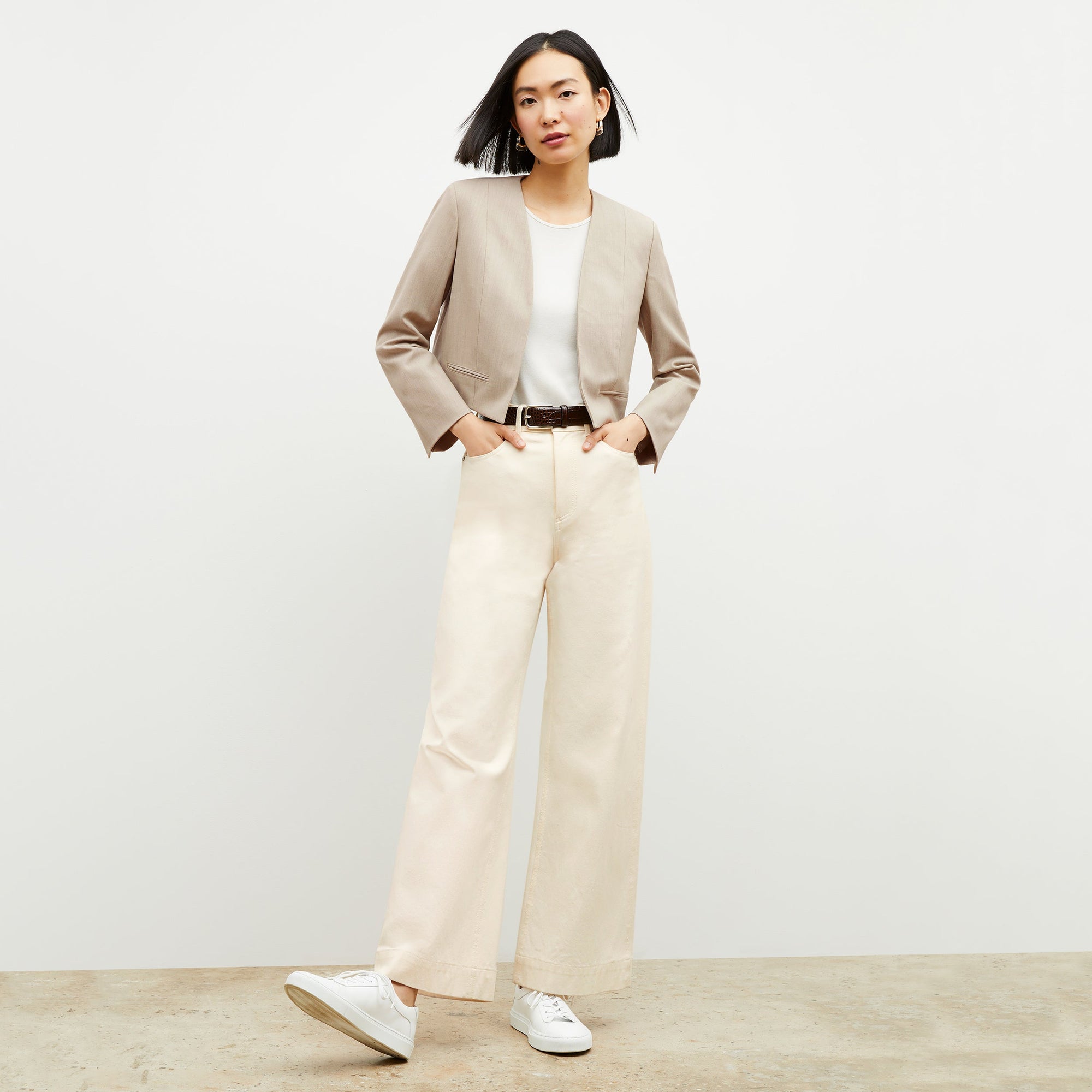 Front image of a woman standing wearing the milo jean in tusk  | Exclude