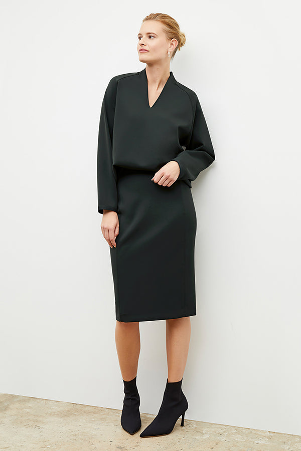 Image of a woman wearing the Chantal Skirt - Light Scuba in Forest | Exclude