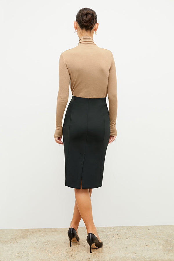 Front image of a woman standing wearing the axam top in camel | Exclude
