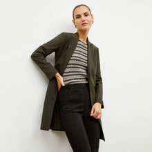 Front image of a woman wearing the gwynne dress in olive