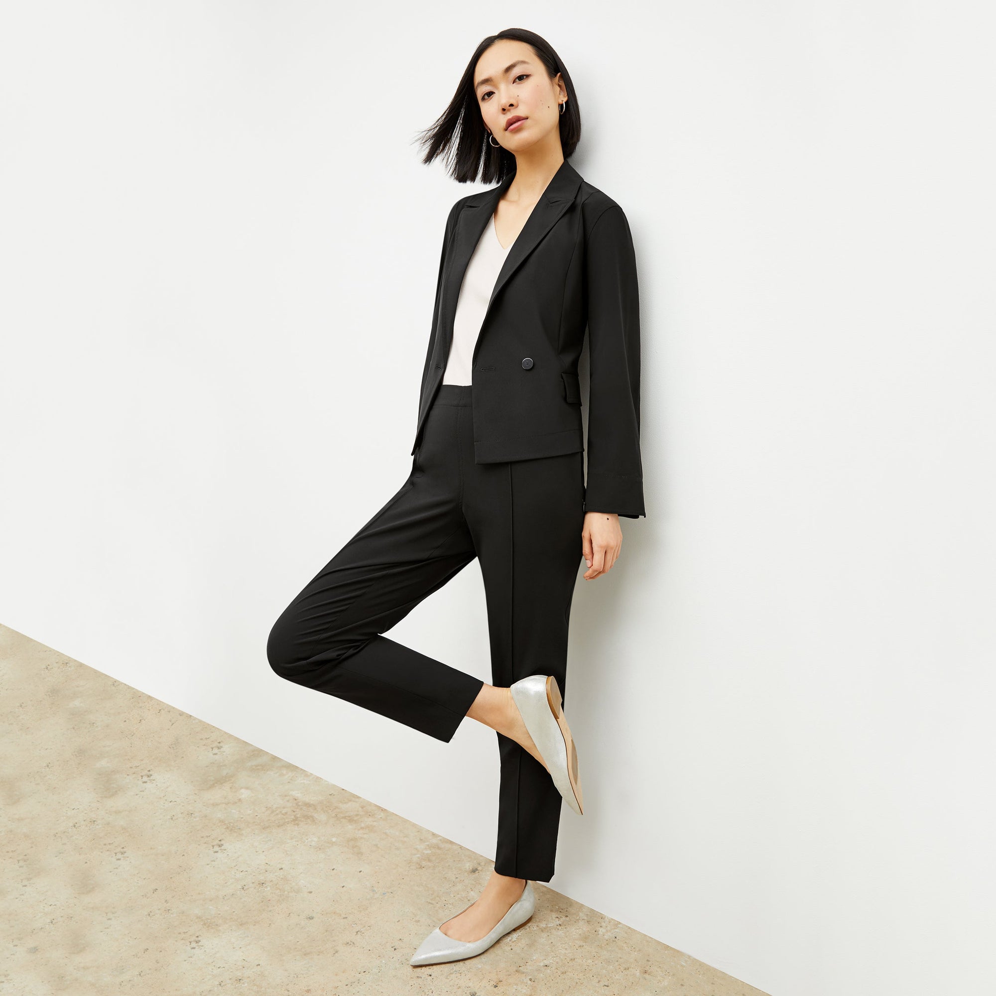 Front image of a woman standing wearing the Colby Jogger in Black | Exclude