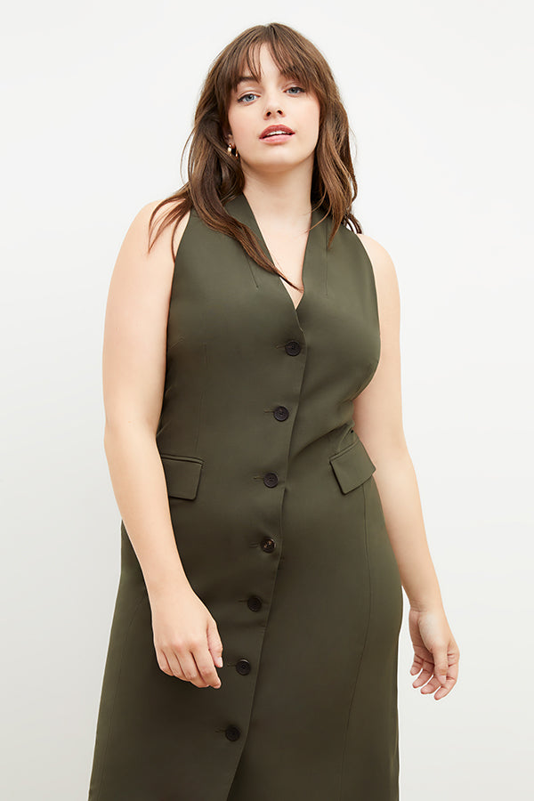 Back image of a woman wearing the Cassandra dress in origamitech in olive | Exclude 