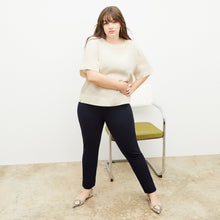 Front image of a woman standing wearing the Hockley pant easy cotton in Black | Exclude