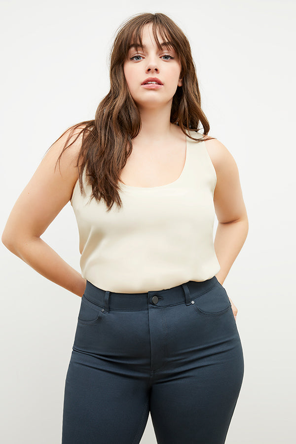 Front image of a woman standing wearing the stella legging in black | Exclude | Grid Hover