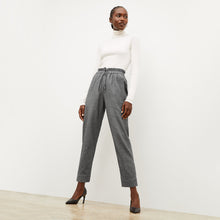 Front image of a woman standing wearing the axam top in ivory | Lead