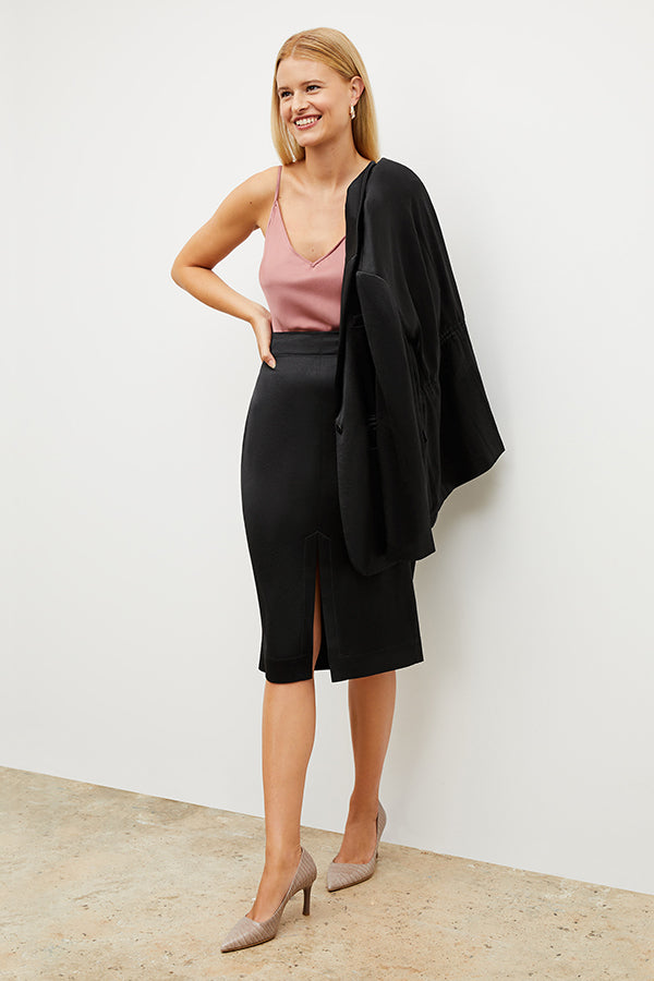Image of a woman wearing the Penny Skirt in Black | Exclude | Grid