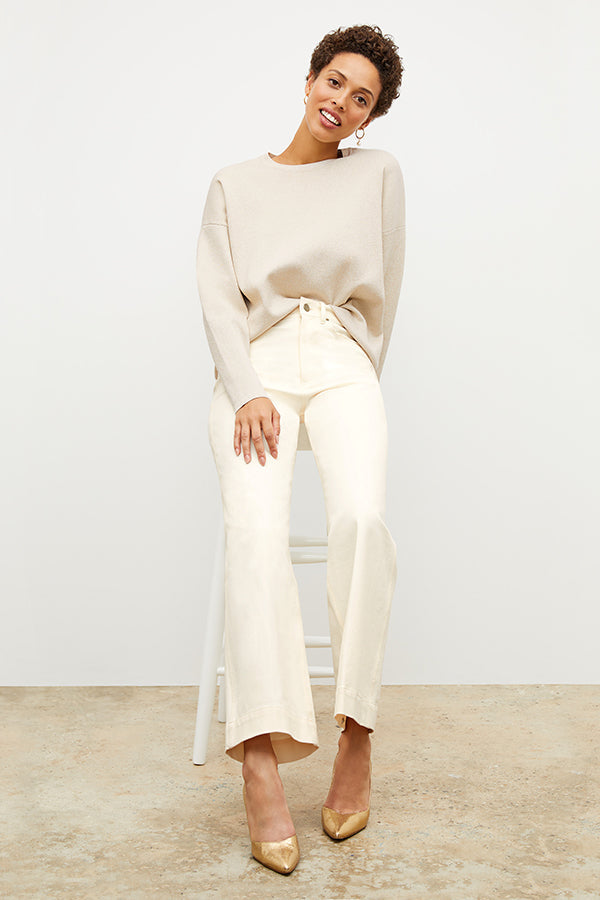 Front image of a woman standing wearing the milo jean in tusk | Exclude