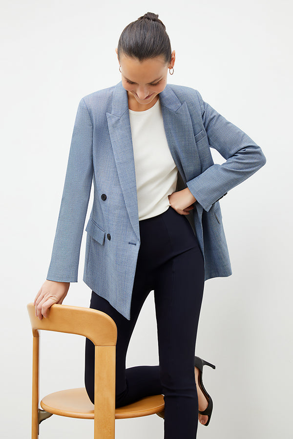 Front image of a woman standing wearing the foster pant in dark navy | Exclude