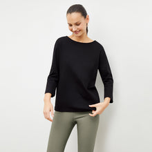 Front image of a woman wearing the skinny foster in thyme