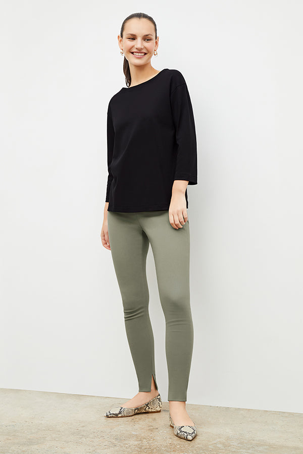 Front image of a woman wearing the skinny foster in thyme | Exclude